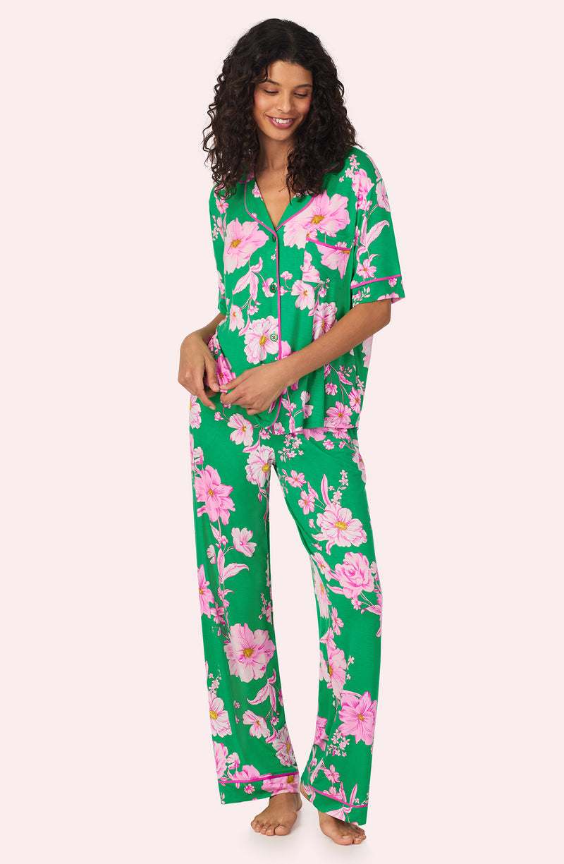 A lady wearing DAKOTA PJ SET IN EMERALD BLOOMS