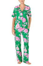 A lady wearing DAKOTA PJ SET IN EMERALD BLOOMS