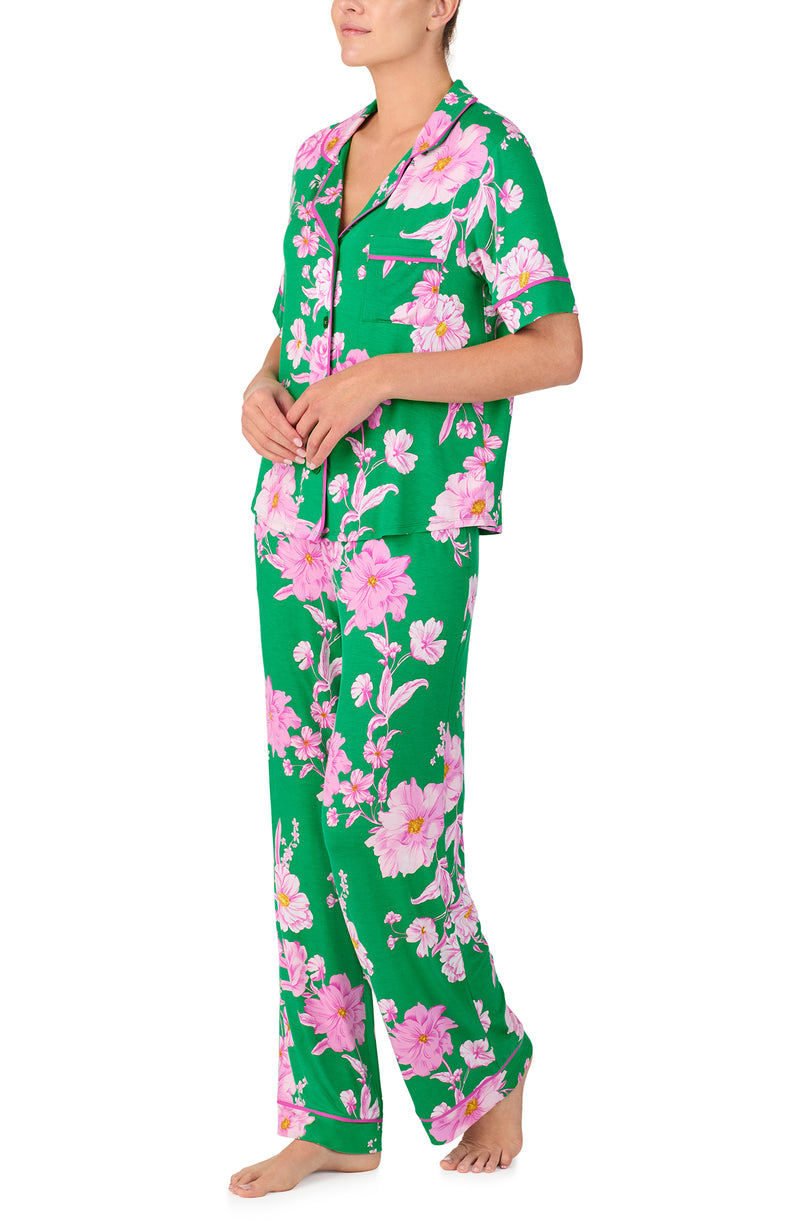 A lady wearing DAKOTA PJ SET IN EMERALD BLOOMS