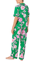 A lady wearing DAKOTA PJ SET IN EMERALD BLOOMS