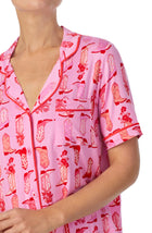 A lady wearing pink short sleeve teagan pj set with blushing cowgirl.