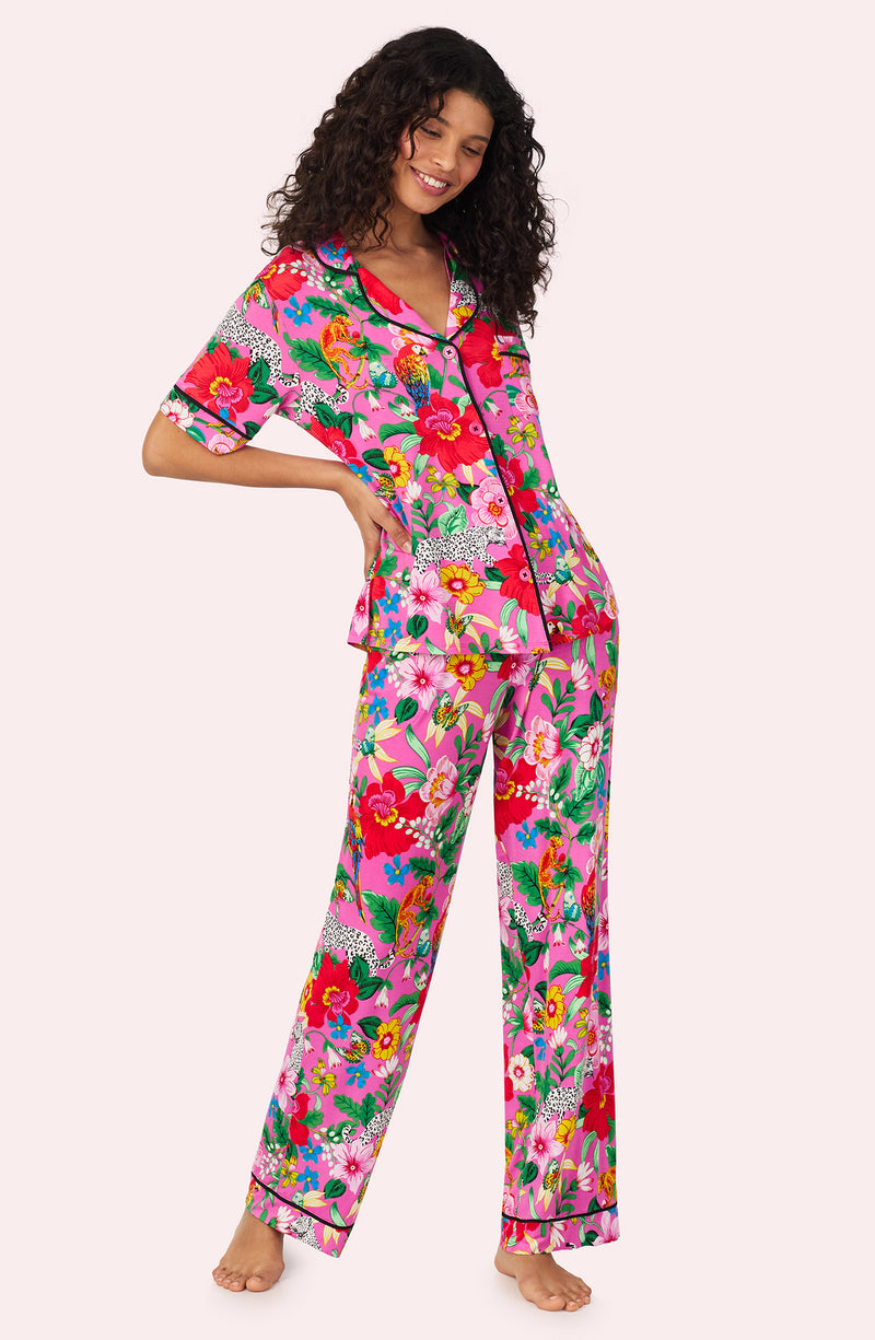 A lady wearing DAKOTA PJ SET IN CRITTER FLORAL