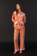 A lady wearing Dolly Woven Pj Set In Blushing Zebra print