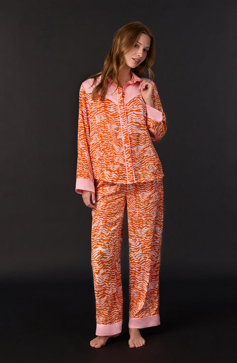 A lady wearing Dolly Woven Pj Set In Blushing Zebra print