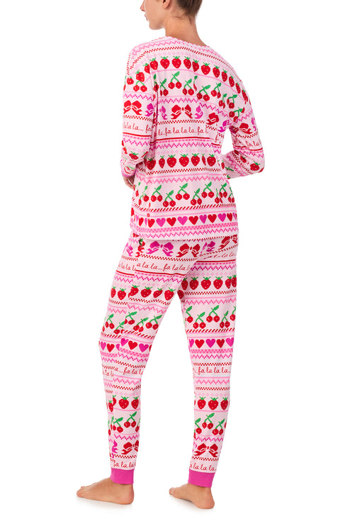 A lady wearing Lorena Knit Long Pj Set In Fa La La Fairisle print