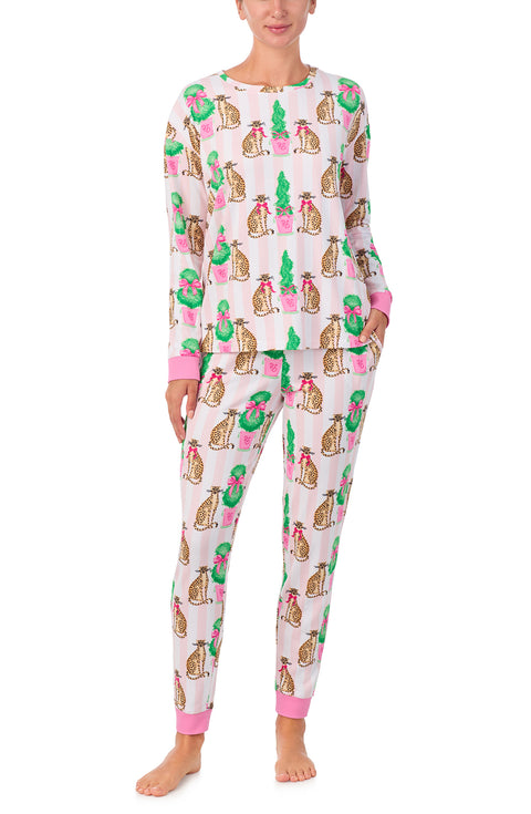 A lady wearing Lorena Knit Long Pj Set In Feline Festive print