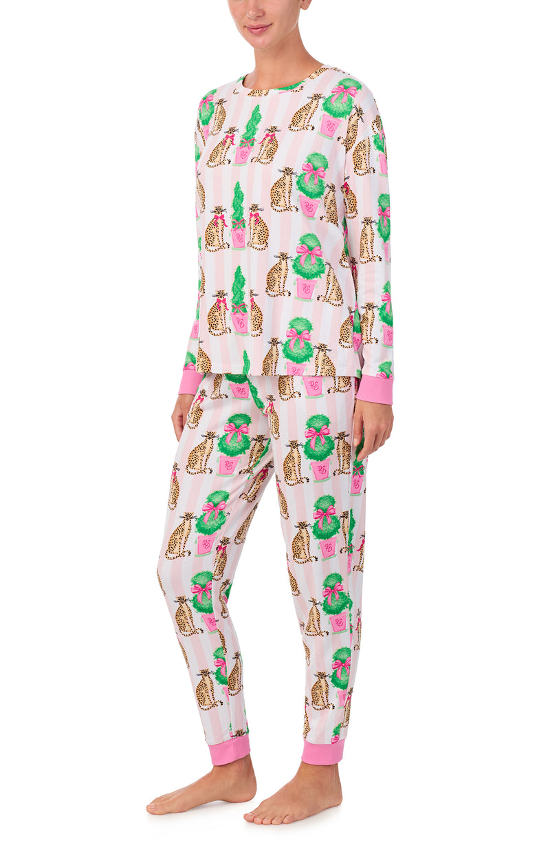 A lady wearing Lorena Knit Long Pj Set In Feline Festive print