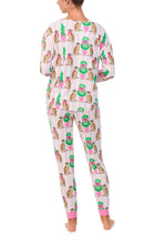 A lady wearing Lorena Knit Long Pj Set In Feline Festive print