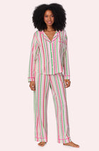 A lady wearing Charlotte Knit Pj Set In Merry Hearts print