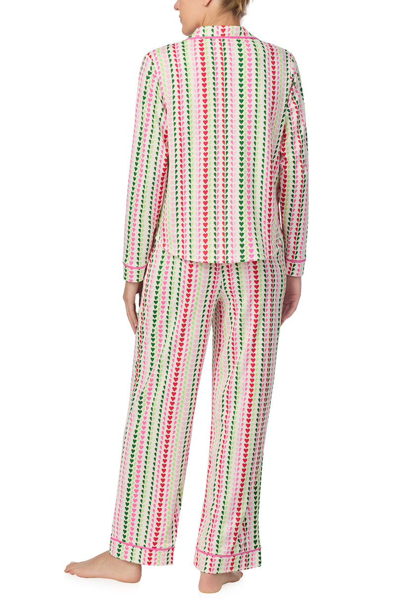 A lady wearing Charlotte Knit Pj Set In Merry Hearts print