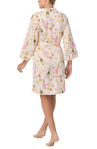 A lady wearing Nadia Knit Robe In Festive Fizz print