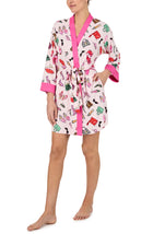 A lady wearing Nadia Knit Robe In Shopping Spree print