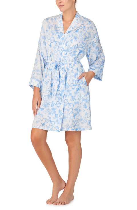 A lady wearing Becca Woven Robe In Butterflies & Bows