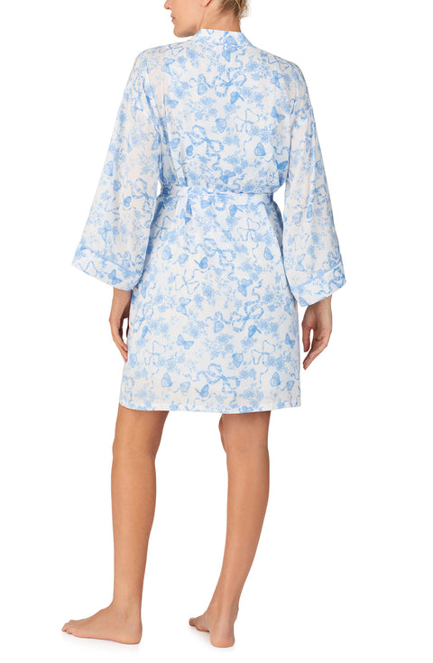 A lady wearing Becca Woven Robe In Butterflies & Bows