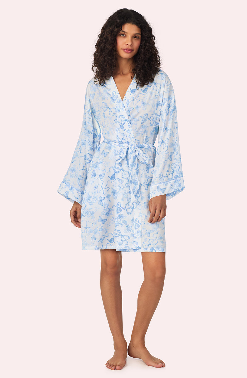 A lady wearing Becca Woven Robe In Butterflies & Bows