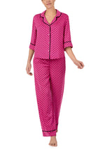 A lady wearing quarter sleeve Gramercy Woven Pj Set In Sweet Bee with bee geo print.