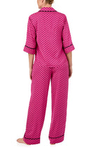 A lady wearing quarter sleeve Gramercy Woven Pj Set In Sweet Bee with bee geo print.