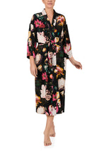 A lady wearing Lydia Woven Maxi Robe in Midnight Garden with black Floral print