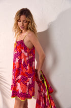 A lady wearing multi color izzy chemise with summer orchid print.