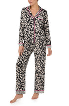 A lady wearing long sleeve Charlotte Knit Pj Set In Daisy Delight with black daisies print