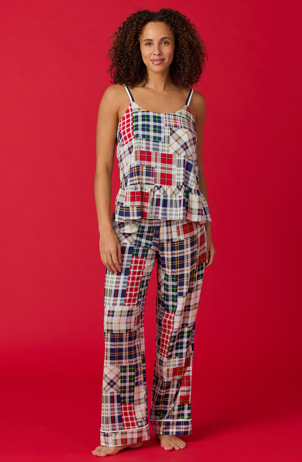 A lady wearing a sleeveless natalie pj set with country plaid print.