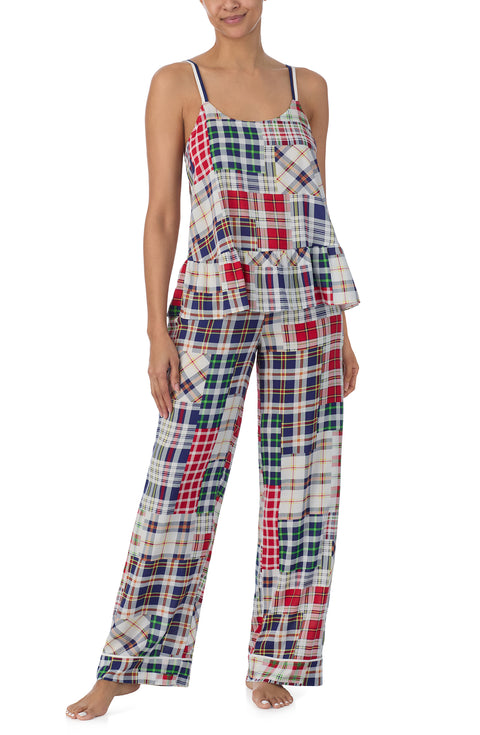 A lady wearing a sleeveless natalie pj set with country plaid print.