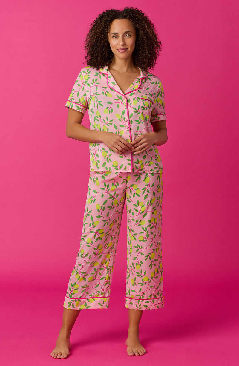 A lady wearing pink short sleeve chelsea crop pj set with pink lemonade print. 
