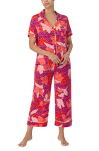 A lady wearing multi color short sleeve chelsa crop pj set with summer orchid.