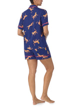 A lady wearing blue short sleeve Victoria Short Pj Set with Royal Leopard print