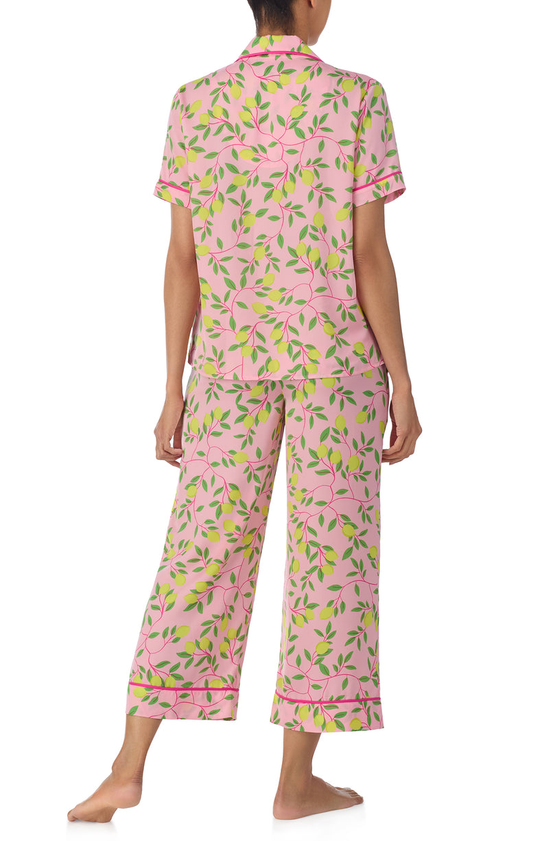 A lady wearing pink short sleeve chelsea crop pj set with pink lemonade print. 